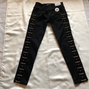 Ladies All Black Jeans with Gold Embellishments.